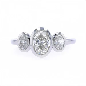 Three Stone Oval Diamond Floating Bezel Engagement Ring Platinum